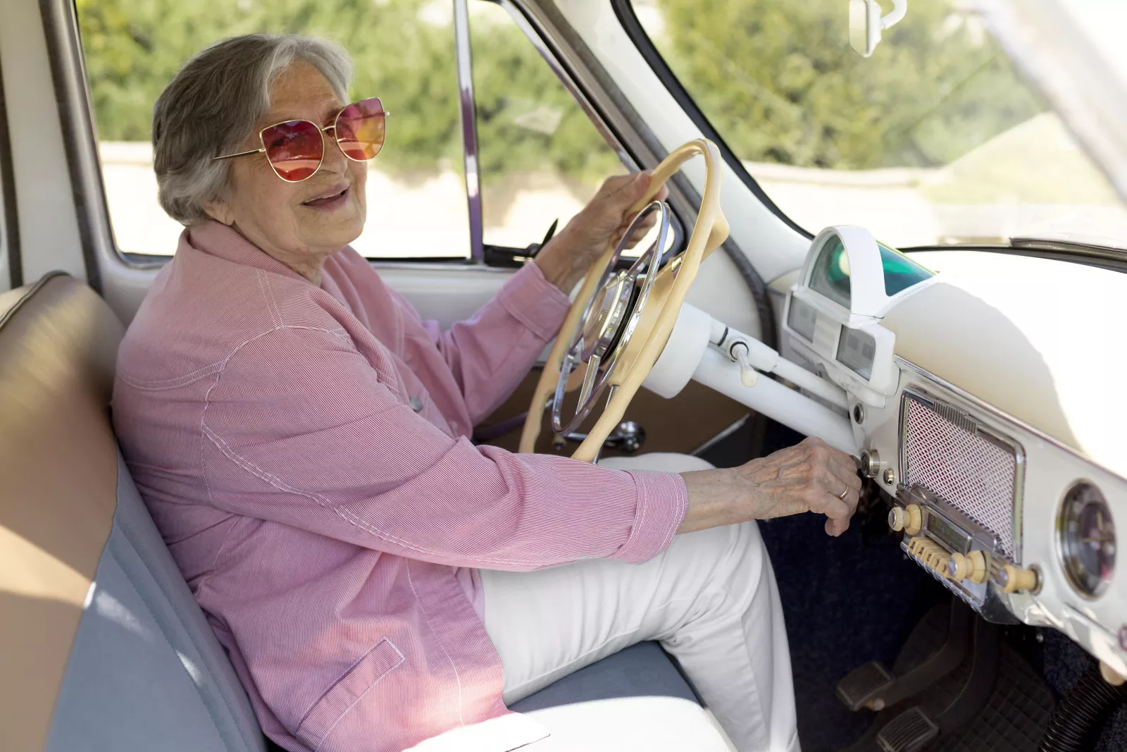 699598f6ea747_happy-senior-woman-traveling-alone-by-car.webp